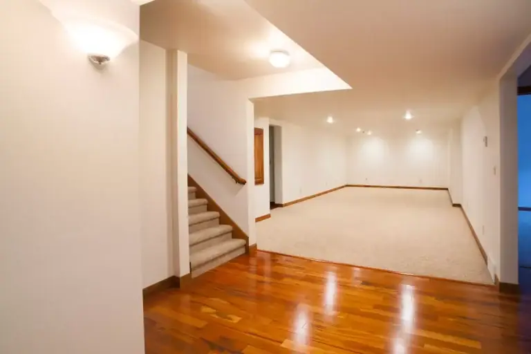 Finished basement with hardwood floors and recessed lighting