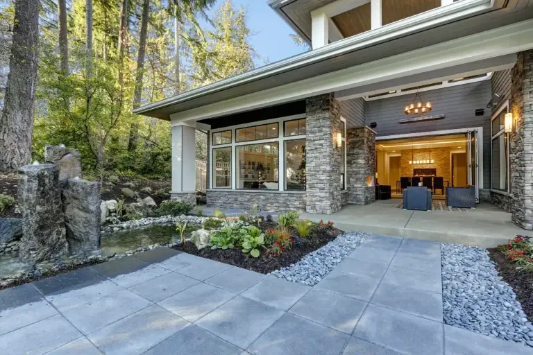 Stone patio and landscaped garden at a renovated home