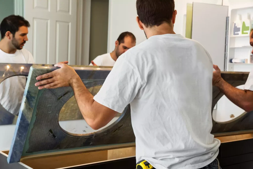 CNG Contracting technicians installing a bathroom countertop in a Toronto home
