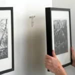 Professional Artwork & Mirror Hanging Toronto securing heavy frame by CNG Contracting.