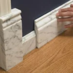 Professional Baseboards & Casing Installation Toronto finishing door trim by CNG Contracting.