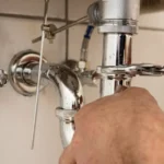 Professional Bathroom Fixture Removal & Replacement Toronto removing old vanity by CNG Contracting.