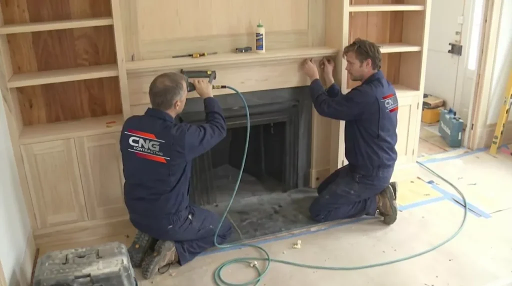 Professional Built-in Bookcases & Mantels Toronto installation with custom shelving by CNG Contracting.
