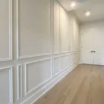 Professional Crown Molding & Wainscoting Installation Toronto finishing corner joints by CNG Contracting.