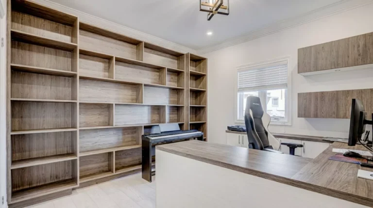 Professional Custom Shelving & Built-in Solutions Toronto installing living room wall unit by CNG Contracting.