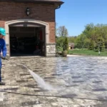 Professional Driveway & Patio Washing Toronto cleaning interlock stone with surface cleaner by CNG Contracting.