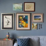 Professional Gallery Wall Design & Installation Toronto showing perfectly spaced frames in a hallway by CNG Contracting.