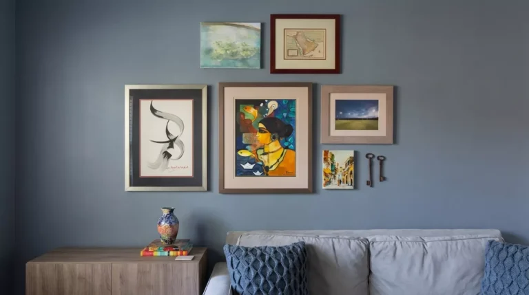 Professional Gallery Wall Design & Installation Toronto showing perfectly spaced frames in a hallway by CNG Contracting.