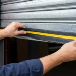 Professional Garage Door Weatherstripping Installation Toronto sealing bottom gap by CNG Contracting.