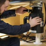 Professional Garbage Disposal Installation under kitchen sink in Toronto.