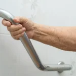 Professional Grab Bar Installation in Bath Toronto applying silicone sealant by CNG Contracting.