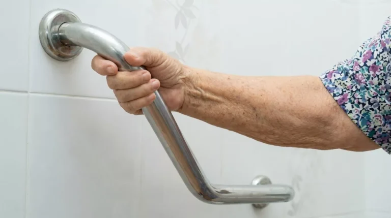 Professional Grab Bar Installation in Bath Toronto applying silicone sealant by CNG Contracting.