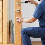 Professional Lever Handle Door Options Toronto installing matte black hardware by CNG Contracting.