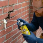 Professional Pest-Proof Sealing Toronto blocking exterior gaps with wire mesh and sealant by CNG Contracting.