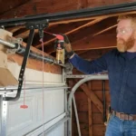 Professional Roller & Track Lubrication Toronto spraying silicone on garage door rollers by CNG Contracting.