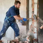 Professional Safe Teardown & Junk Removal Toronto dismantling old wooden structure by CNG Contracting.