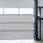 : Professional Safety & Testing Toronto performing garage door reversal test by CNG Contracting.
