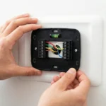 Professional Thermostat Installation Toronto configuring smart device by CNG Contracting.