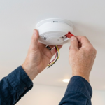 Professional Smoke & Carbon Monoxide Detector Installation Toronto testing interconnected alarm by CNG Contracting.