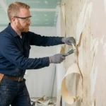 Professional Wallpaper Removal & Texture Touch-Up Toronto stripping old paper by CNG Contracting.