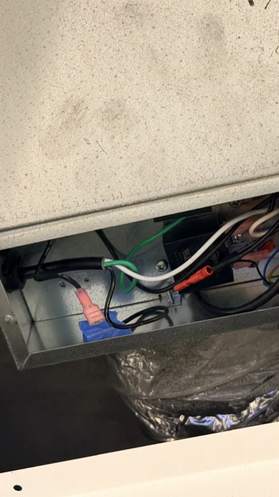 New exhaust fan housing mounted in the ceiling