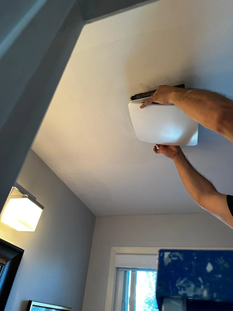 New bathroom exhaust fan with its grille in place