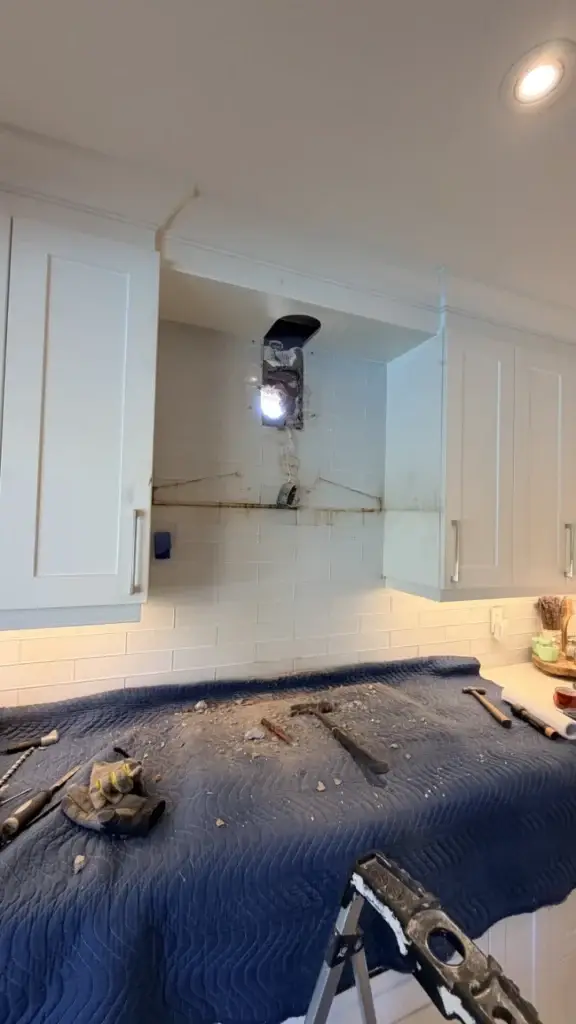 White Mississauga kitchen with the range hood space opened above the stove