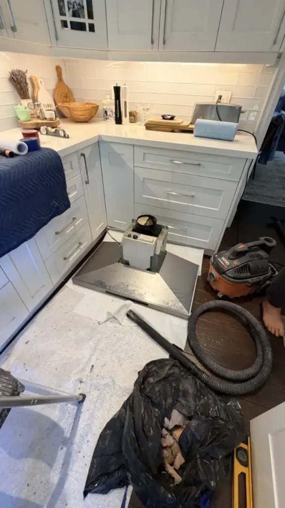 Counters and floor covered before the range hood duct work