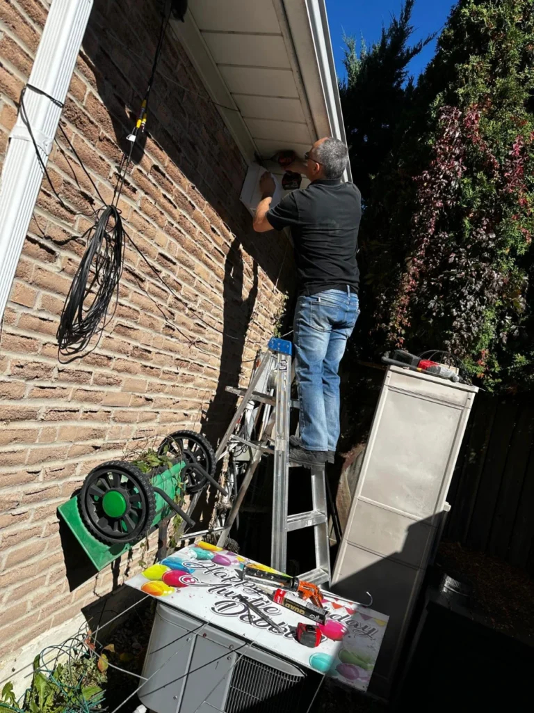 Fitting the range hood vent cap under the soffit