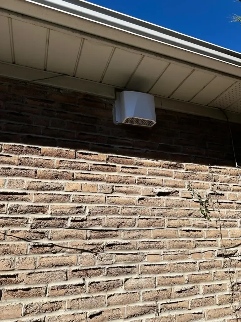 Brick wall of the Mississauga home with the new vent cap