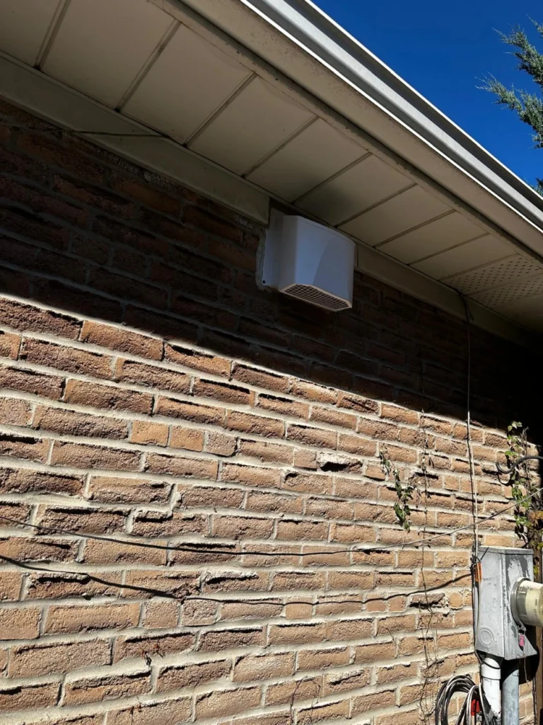 Finished range hood vent on the side of the house