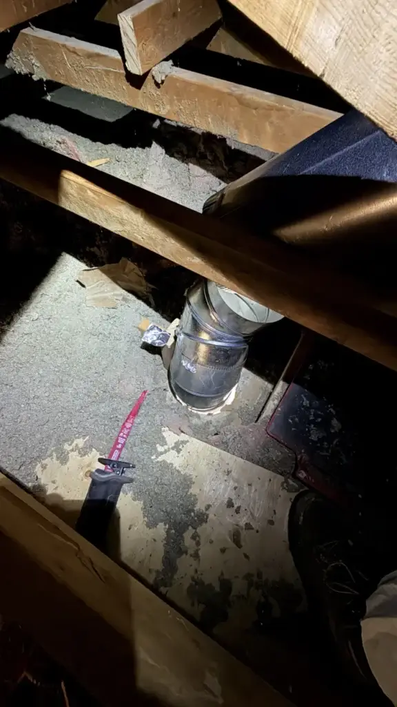 Range hood duct connection between the attic framing