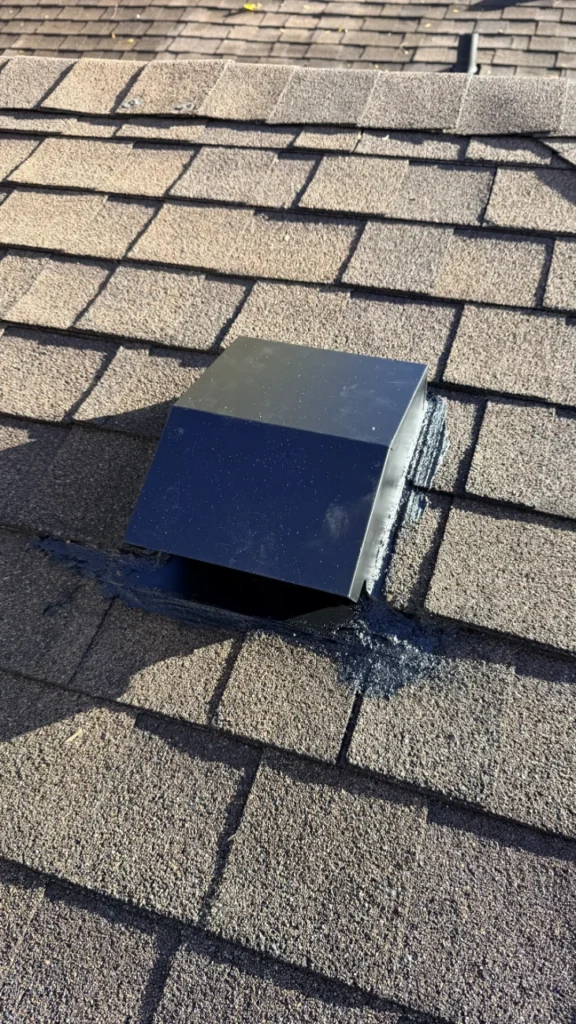 Close-up of the new metal roof cap for the kitchen range hood